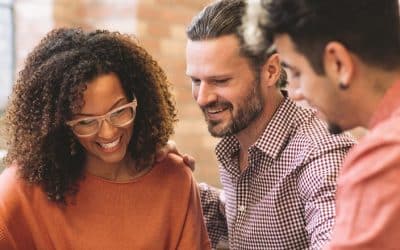 Smiling couple with mortgage agent