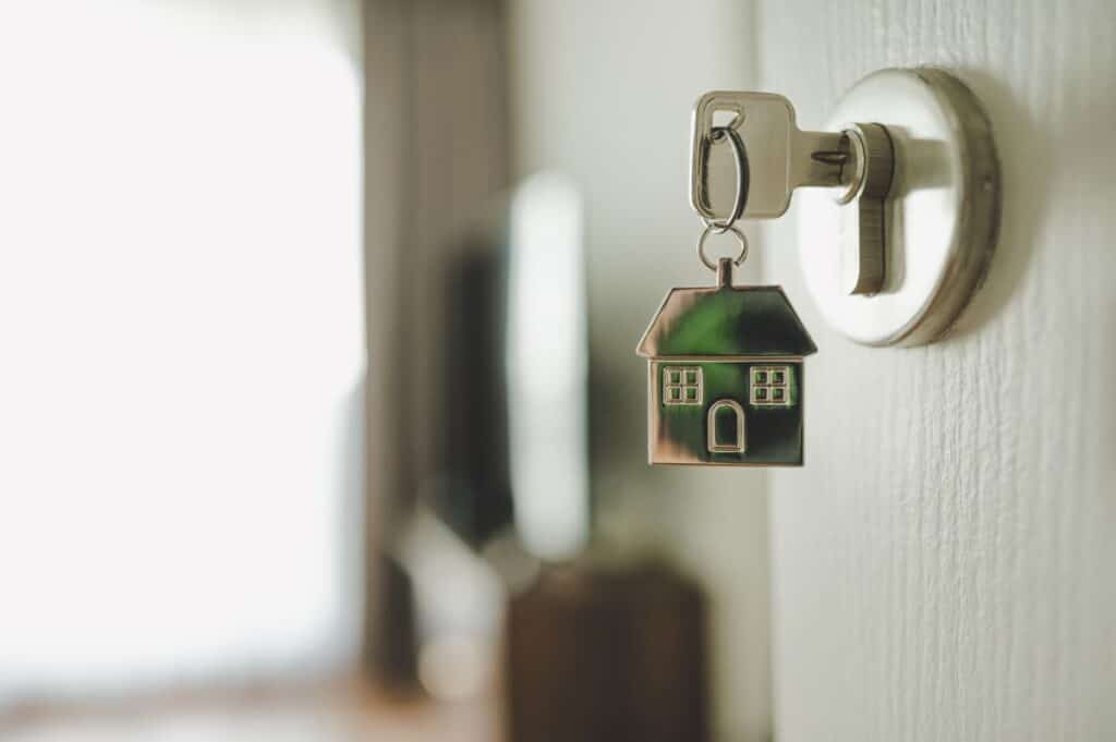 Key in a door with a house keyring