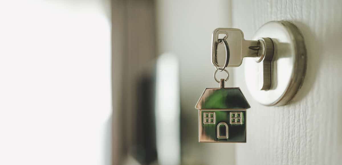 Key in a door with a house keyring