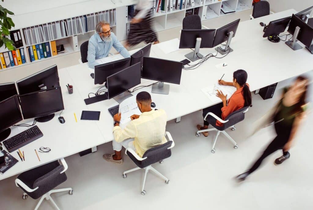 Employees at their desks in an office