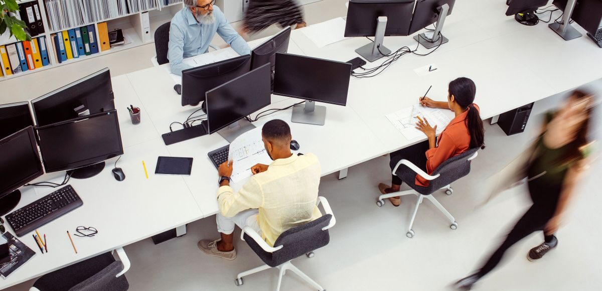 Employees at their desks in an office